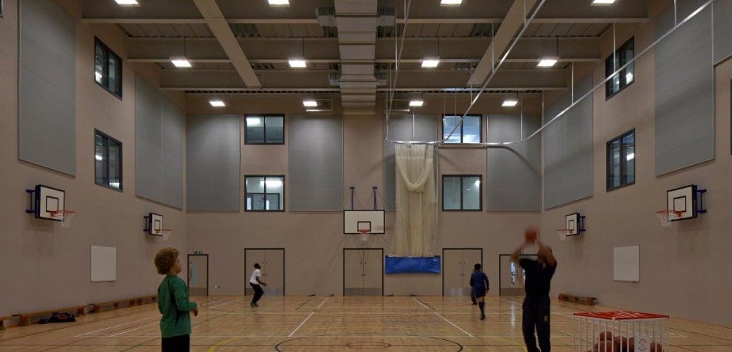 Flush fitting doorsets for the sports hall with fire rated containment screens above